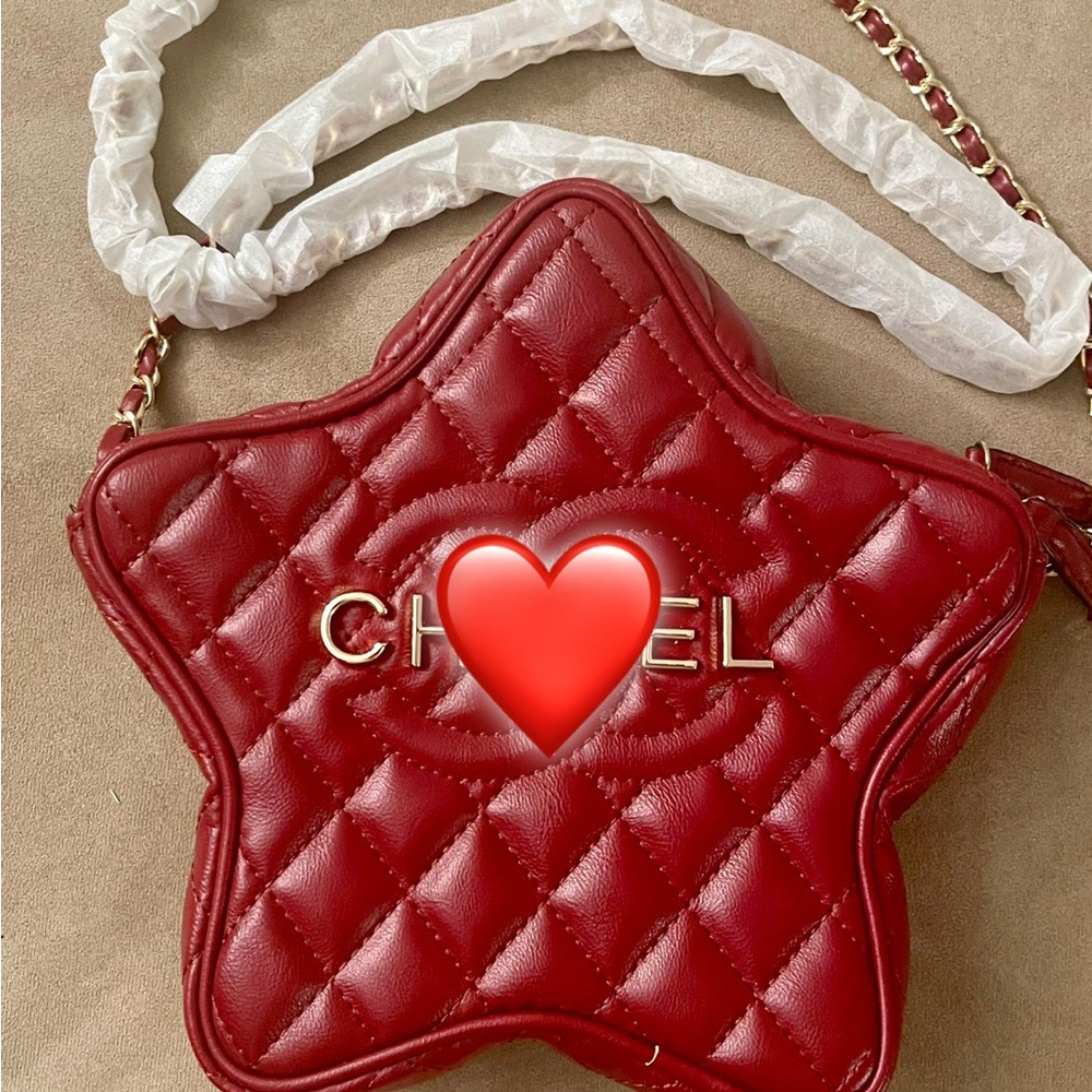 CH@N*L Logo Gold print in Chic Red Star-Shaped Quilted Bag